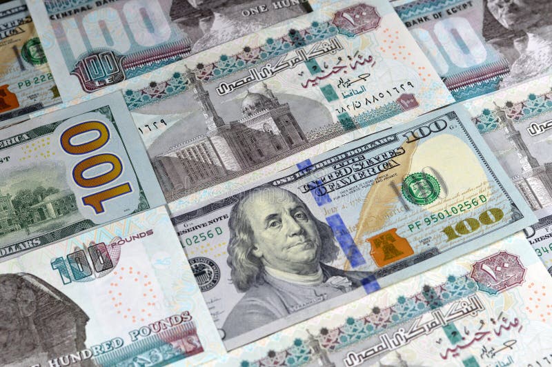 Egyptian money banknotes of 100 EGP LE one hundred pounds bill and USD American cash of 100 dollars, money exchange rates of Egypt and United states of America, inflation and economy concept. Egyptian money banknotes of 100 EGP LE one hundred pounds bill and USD American cash of 100 dollars, money exchange rates of Egypt and United states of America, inflation and economy concept