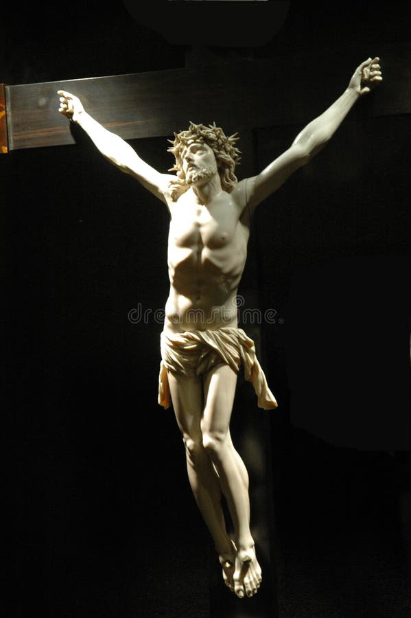 White marble sculpture of Jesus Christ on a partially visable wooden cross. This is on display at Palma Cathedral, Mallorca, Spain. White marble sculpture of Jesus Christ on a partially visable wooden cross. This is on display at Palma Cathedral, Mallorca, Spain.