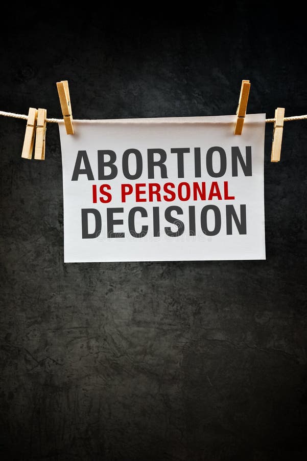 Pregnancy Abortion is personal decision, message printed on paper hanged on rope with clothes pins. Pregnancy Abortion is personal decision, message printed on paper hanged on rope with clothes pins.