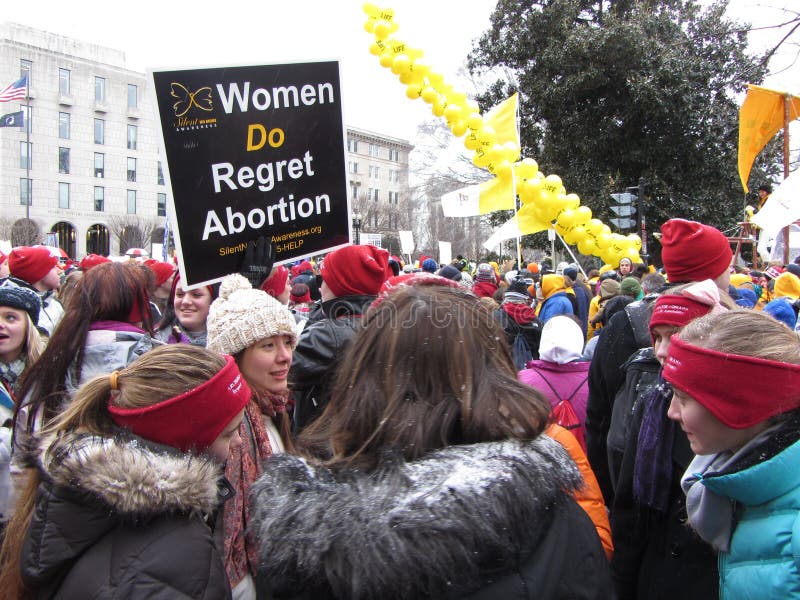 Photo of pro life protesters in downtown washington dc near the us capitol on 1/25/13. These protesters are against abortion and the supreme court decision (roe versus wade) that allows a woman to choose whether or not she wants to bear a child. This the 40 year anniversary of the supreme court decision. Photo of pro life protesters in downtown washington dc near the us capitol on 1/25/13. These protesters are against abortion and the supreme court decision (roe versus wade) that allows a woman to choose whether or not she wants to bear a child. This the 40 year anniversary of the supreme court decision.