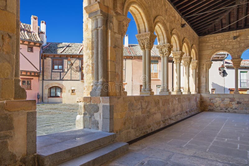 Segovia - The portico of Romanesque church Iglesia de San Lorenzo and the square with the same name. Segovia - The portico of Romanesque church Iglesia de San Lorenzo and the square with the same name.