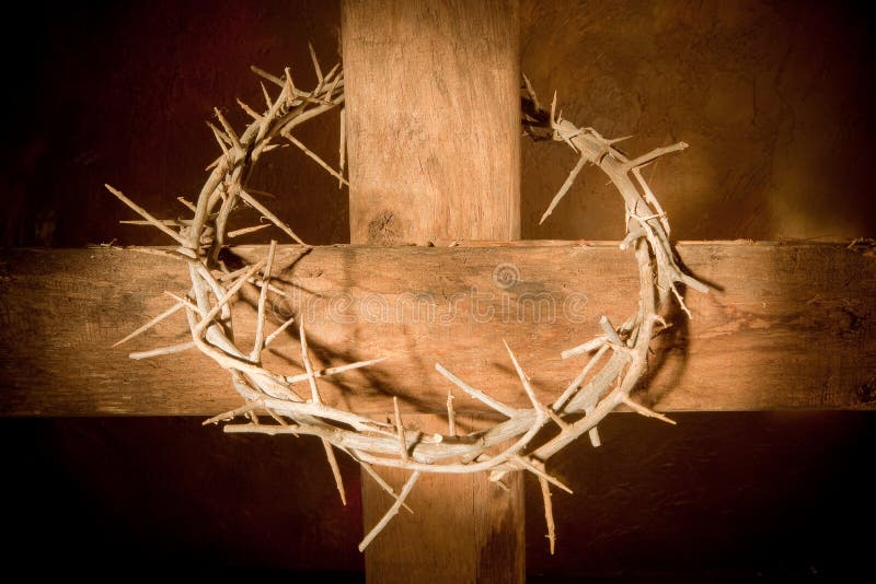 Crown of thorns hanging on a wooden cross at Easter. Crown of thorns hanging on a wooden cross at Easter