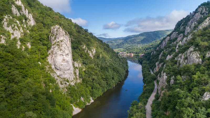 Decebal Head sculpted in rock, Danube Gorges Cazanele Dunarii , Romania. Aerial view. Decebal Head sculpted in rock, Danube Gorges Cazanele Dunarii , Romania. Aerial view.