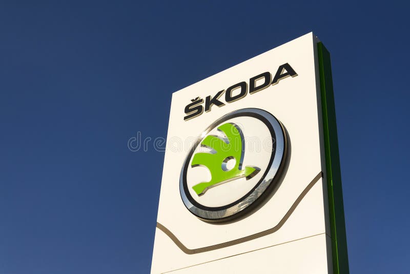 PRAGUE, CZECH REPUBLIC - MARCH 31: Skoda Auto automobile manufacturer from Volkswagen Group company logo in front of dealership building on March 31, 2017 in Prague, Czech republic. Skoda plans 5 fully-electric vehicles on sale by 2025. PRAGUE, CZECH REPUBLIC - MARCH 31: Skoda Auto automobile manufacturer from Volkswagen Group company logo in front of dealership building on March 31, 2017 in Prague, Czech republic. Skoda plans 5 fully-electric vehicles on sale by 2025.