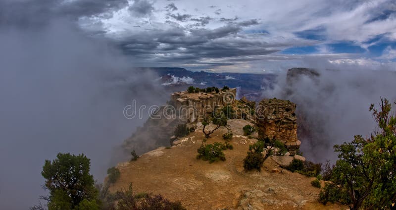 Moran Point at Grand Canyon South Rim Arizona with clouds rising up from below the cliffs. Moran Point at Grand Canyon South Rim Arizona with clouds rising up from below the cliffs