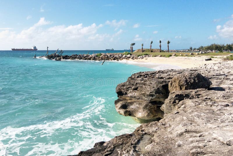 Freeport, Grand Bahama/Bahamas - Sep 01, 2016: Panoramic beach view with rocks and stones in Bahamas. Freeport, Grand Bahama/Bahamas - Sep 01, 2016: Panoramic beach view with rocks and stones in Bahamas.