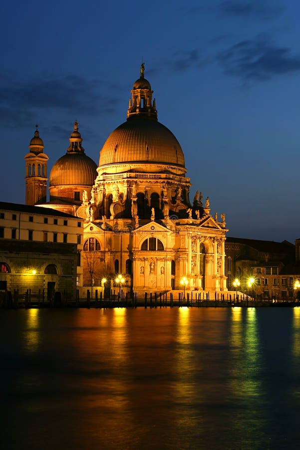 Vertical oriented photo of Santa Maria della Salute basilica at evening in Venice, Italy. Vertical oriented photo of Santa Maria della Salute basilica at evening in Venice, Italy.