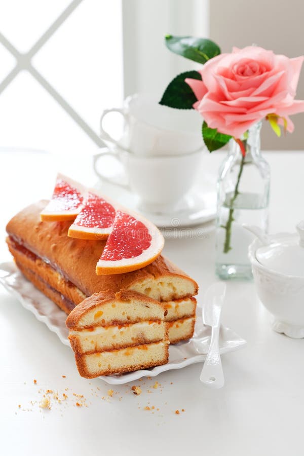 Loaf cake with cream cheese and grapefruit jam, selective focus. Loaf cake with cream cheese and grapefruit jam, selective focus