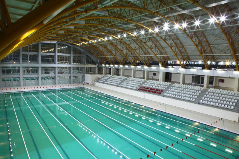 Interior details of lanes and seating in Olympic sized swimming pool. Interior details of lanes and seating in Olympic sized swimming pool.