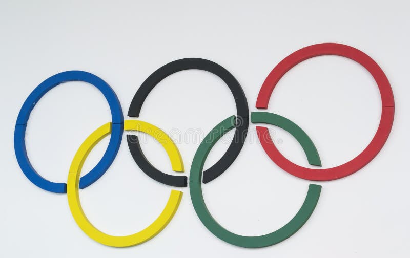 Five colored custom made circles representing the Olympic symbols , mounted on a white wall. Five colored custom made circles representing the Olympic symbols , mounted on a white wall