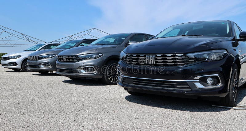 Tavagnacco, Italy. April 25, 2021. New models of Fiat Tipo cars lined up outside the local dealer of the italian automaker, now in Stellantis group. Tavagnacco, Italy. April 25, 2021. New models of Fiat Tipo cars lined up outside the local dealer of the italian automaker, now in Stellantis group.