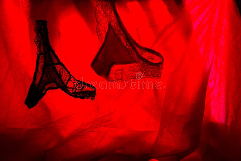 woman underwear in red light. sex concept. woman underwear in red light. sex concept