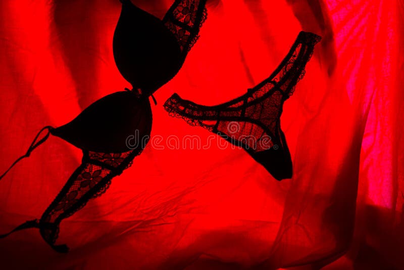 woman underwear in red light. sex concept. woman underwear in red light. sex concept