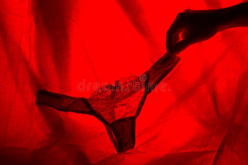 woman underwear in red light. sex concept. woman underwear in red light. sex concept