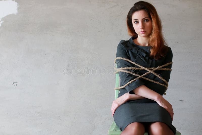 Woman businessman sitting on a chair associated workaholic concept. Woman businessman sitting on a chair associated workaholic concept