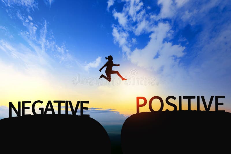 Woman jump through the gap between Negative to Positive on sunset. Woman jump through the gap between Negative to Positive on sunset