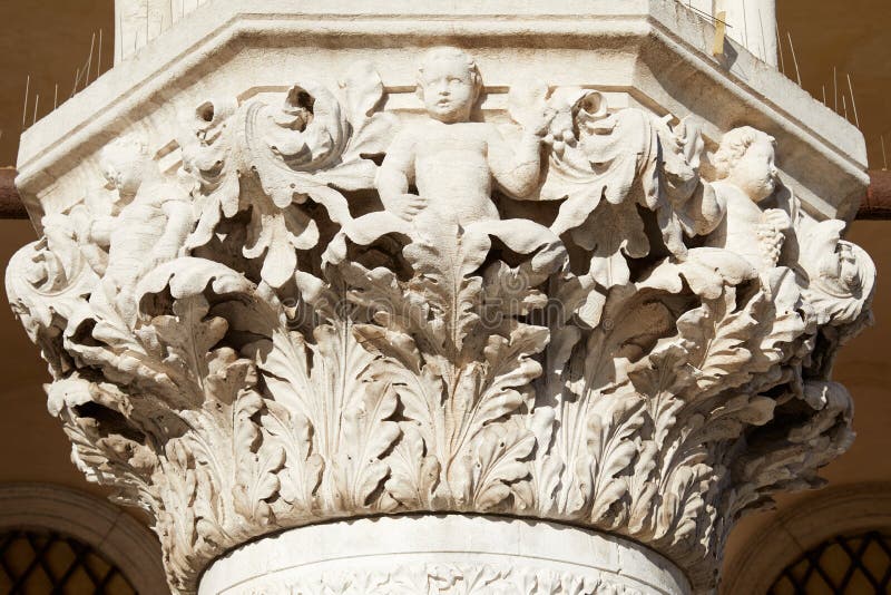 Venice, white capital sculpture of Doge palace in a sunny day in Italy. Venice, white capital sculpture of Doge palace in a sunny day in Italy