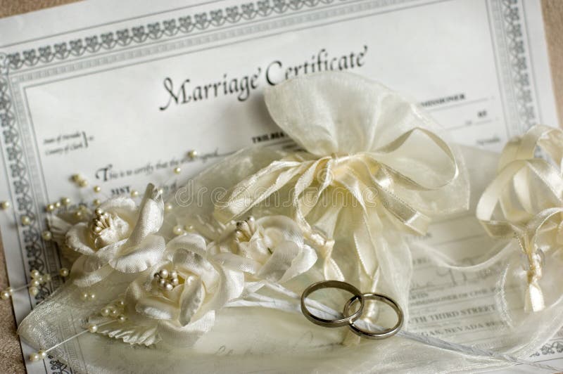 Marriage certificate and wedding rings. Marriage certificate and wedding rings