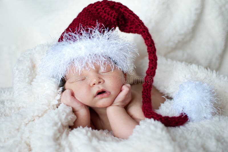 Cute sleeping baby in a Santa hat. Cute sleeping baby in a Santa hat