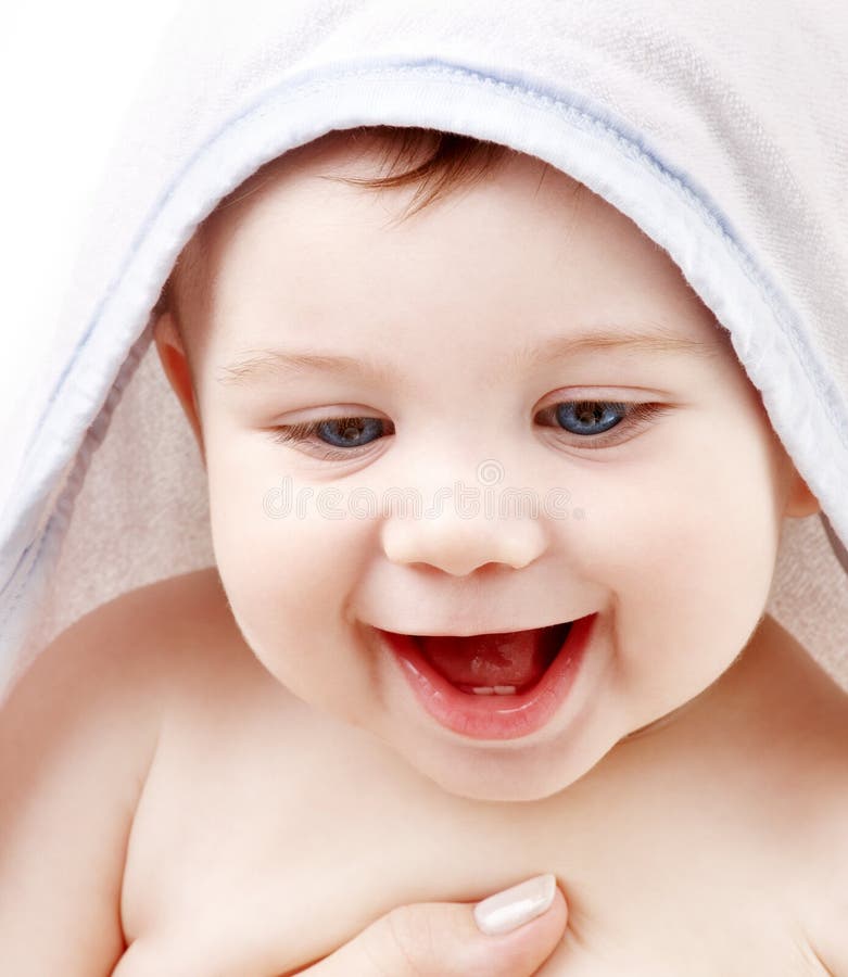 Happy baby with terry hoodie robe on head over white. Happy baby with terry hoodie robe on head over white