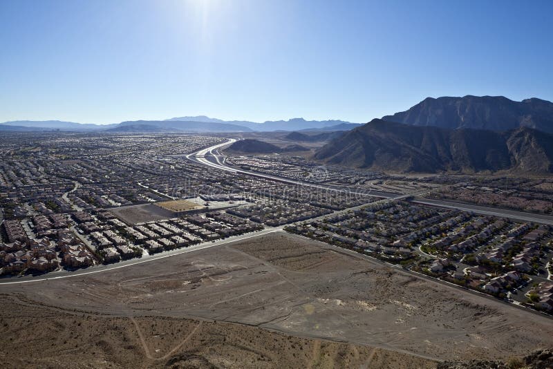 Desert suburban sprawl viewed from Lone Mountain peak towards the Summerlin neighborhood of Las Vegas Nevada. Desert suburban sprawl viewed from Lone Mountain peak towards the Summerlin neighborhood of Las Vegas Nevada.
