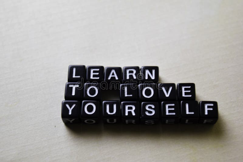 Learn to Love Yourself on wooden blocks. Business and inspiration concept. Learn to Love Yourself on wooden blocks. Business and inspiration concept