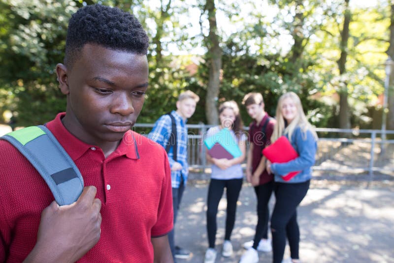 Teenage Boy Being Gossiped About By School Friends. Teenage Boy Being Gossiped About By School Friends