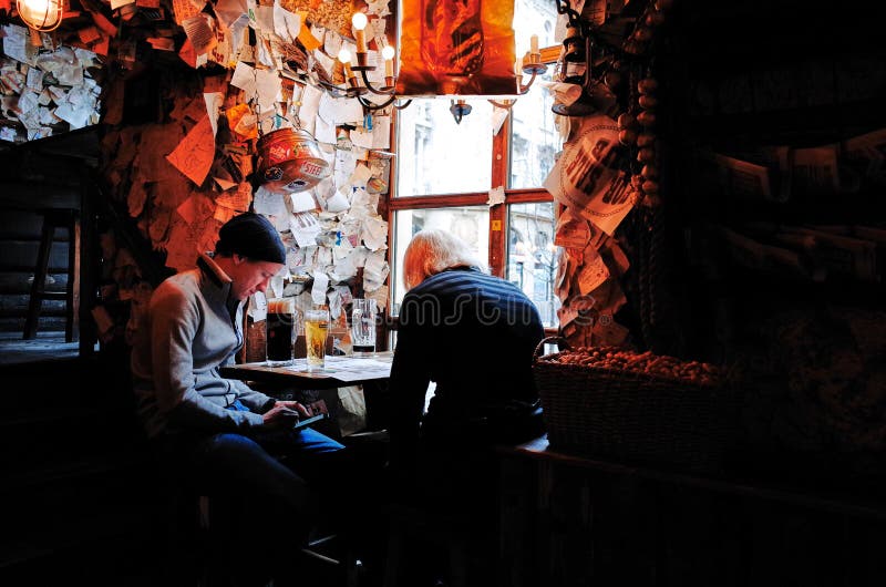 Budapest, HUNGARY - OCTOBER 23, 2014: For Sale Pub. This Budapest bar allows drinkers to leave their mark on the walls, floor, and even ceiling. Budapest, HUNGARY - OCTOBER 23, 2014: For Sale Pub. This Budapest bar allows drinkers to leave their mark on the walls, floor, and even ceiling.