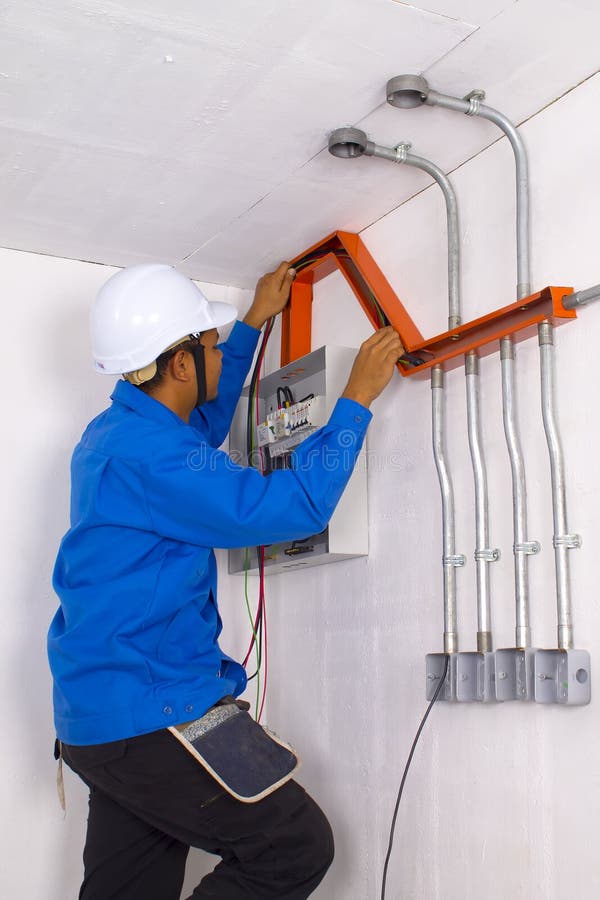 Wire man at work on white wall. Wire man at work on white wall