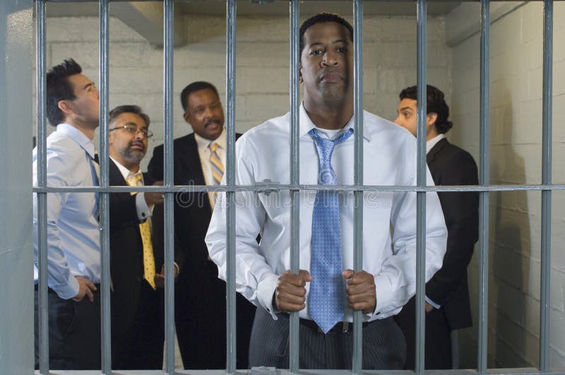 Group of businessman locked in prison cell. Group of businessman locked in prison cell