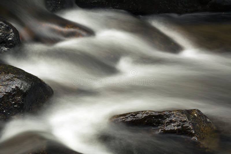 Small rapids in the Sugar River, Newport, New Hampshire. Long exposure, horizontal image. Small rapids in the Sugar River, Newport, New Hampshire. Long exposure, horizontal image.