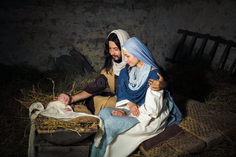 Live Christmas nativity scene in an old barn - Reenactment play with authentic costumes. The baby is a (property released) doll. Live Christmas nativity scene in an old barn - Reenactment play with authentic costumes. The baby is a (property released) doll.