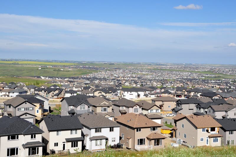 Urban sprawl in Calgary suburbs encroaching onto farm lands. Urban sprawl in Calgary suburbs encroaching onto farm lands.