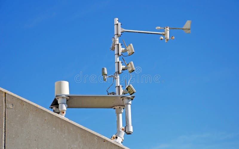 Weather station sensors mounted on top of a building. Weather station sensors mounted on top of a building.