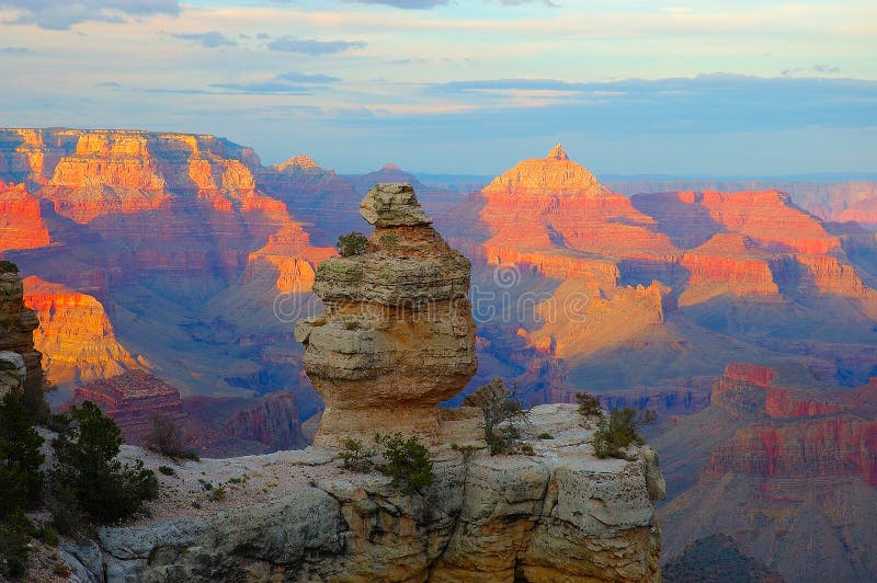 Grand Canyon National Park is one of the United States' oldest national parks and is located in Arizona. Within the park lies the Grand Canyon, a gorge of the Colorado River, considered to be one of the major natural wonders of the world. The Grand Canyon itself, including its extensive system of tributary canyons, is valued for the spectacular combination of large size, depth, and the exposed layering of colorful rocks dating back to Precambrian times. It was created through the incision of the Colorado River and its tributaries after the Colorado Plateau was uplifted and the Colorado River system developed along its present path. Grand Canyon National Park is one of the United States' oldest national parks and is located in Arizona. Within the park lies the Grand Canyon, a gorge of the Colorado River, considered to be one of the major natural wonders of the world. The Grand Canyon itself, including its extensive system of tributary canyons, is valued for the spectacular combination of large size, depth, and the exposed layering of colorful rocks dating back to Precambrian times. It was created through the incision of the Colorado River and its tributaries after the Colorado Plateau was uplifted and the Colorado River system developed along its present path.