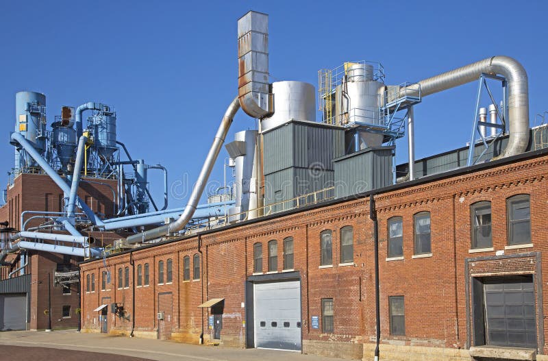 Dubuque Iowa, October 2016: A manufacturing plant in the historic Millwork District of Dubuque, Iowa sits under a blue sky on a warm October day. Dubuque Iowa, October 2016: A manufacturing plant in the historic Millwork District of Dubuque, Iowa sits under a blue sky on a warm October day