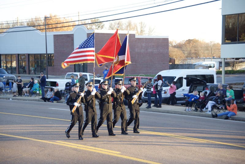 A military, police or ROTC color guards presents the flag of the United States, and other flags at the annual Bartlett, Tennessee Christmas Parade. A military, police or ROTC color guards presents the flag of the United States, and other flags at the annual Bartlett, Tennessee Christmas Parade.