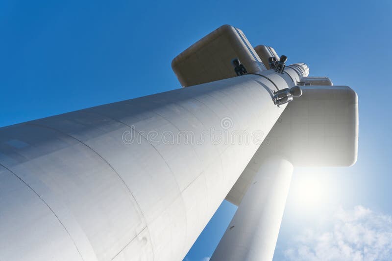 The TV tower in the �i�kov district of Prague in blinding sunlight with view from below. The TV tower in the �i�kov district of Prague in blinding sunlight with view from below
