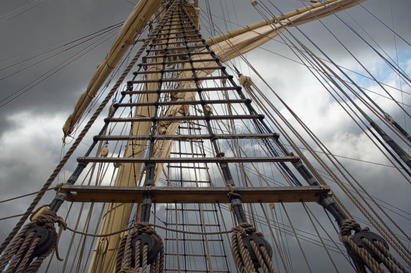 Mast of old sailing ship over the grey sky. Mast of old sailing ship over the grey sky