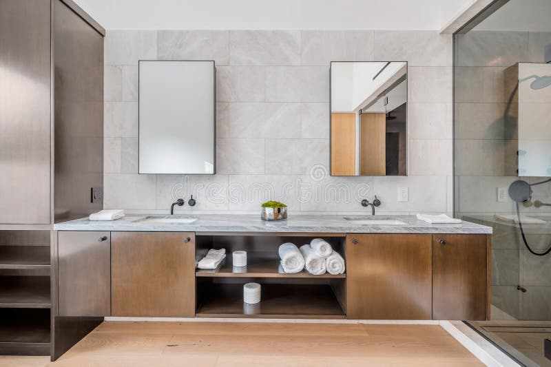 Spacious contemporary bathroom with dual sinks and a shower zone. Spacious contemporary bathroom with dual sinks and a shower zone