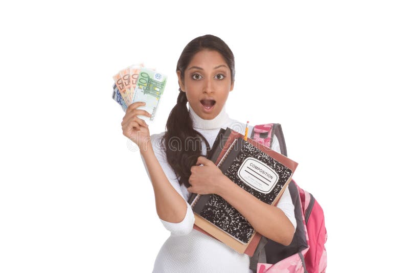 Ethnic Indian college student with compositions notebook, copybooks and backpack holds pile 100 (one hundred), 50 (fifty) and 20 (twenty) euro bills happy getting money help to subsidies costly university cost. Ethnic Indian college student with compositions notebook, copybooks and backpack holds pile 100 (one hundred), 50 (fifty) and 20 (twenty) euro bills happy getting money help to subsidies costly university cost