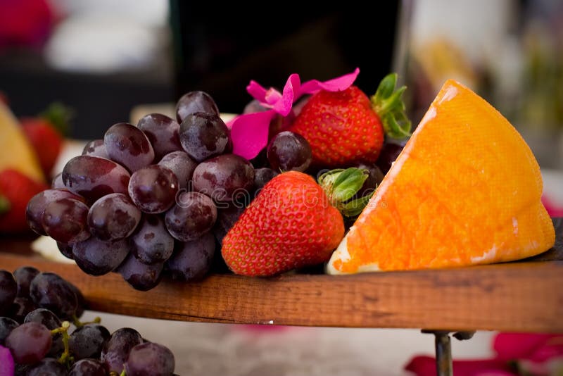 An appetizer selection of cheese, crackers, grapes and strawberries. An appetizer selection of cheese, crackers, grapes and strawberries