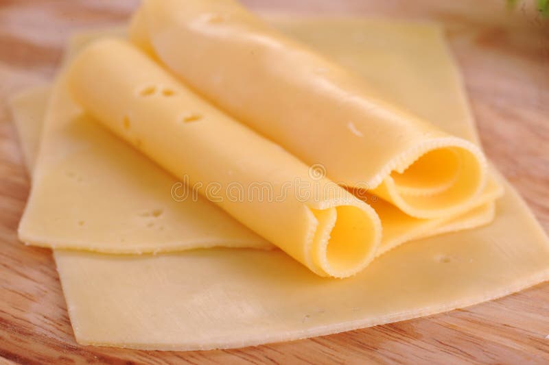 Sliced yellow cheese close up. Sliced yellow cheese close up