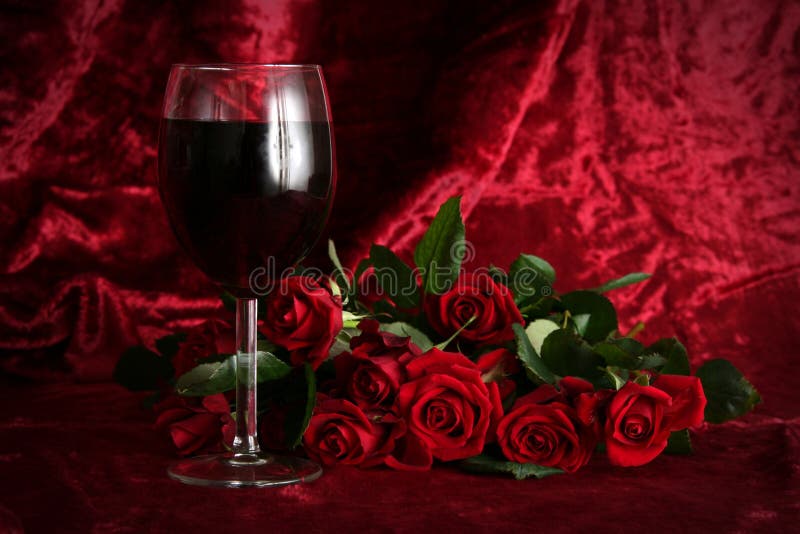 Glass of wine on a dark red background. Glass of wine on a dark red background