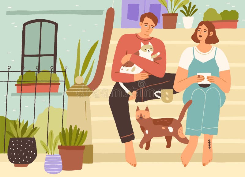 年轻夫妇和猫一起在家门口喝茶放松享受休闲时光