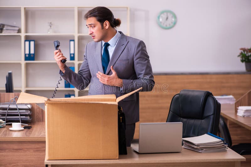 Young employee being dismissed from his work. Young employee being dismissed from his work