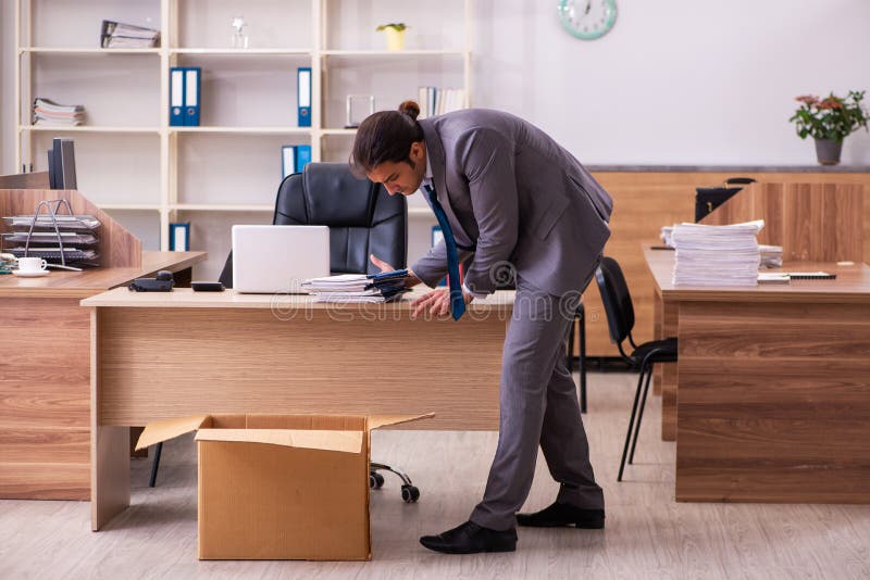 Young employee being dismissed from his work. Young employee being dismissed from his work