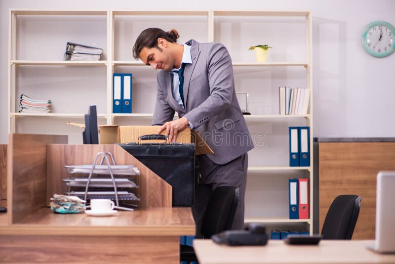 Young employee being dismissed from his work. Young employee being dismissed from his work