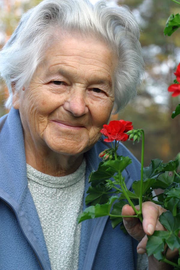 Elderly woman (89 years old) in the garden. Elderly woman (89 years old) in the garden.