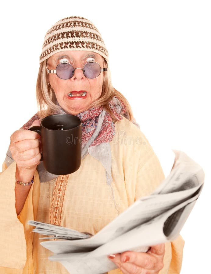 Crazy new age woman in a yellow robe with coffee cup and newspaper. Crazy new age woman in a yellow robe with coffee cup and newspaper